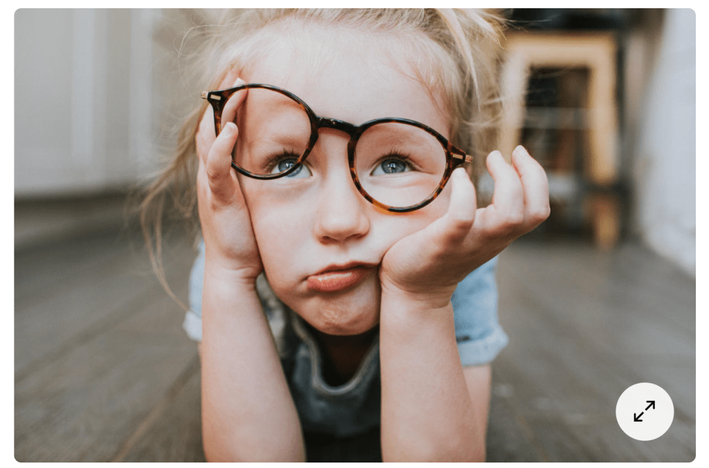 bored child with crooked glasses